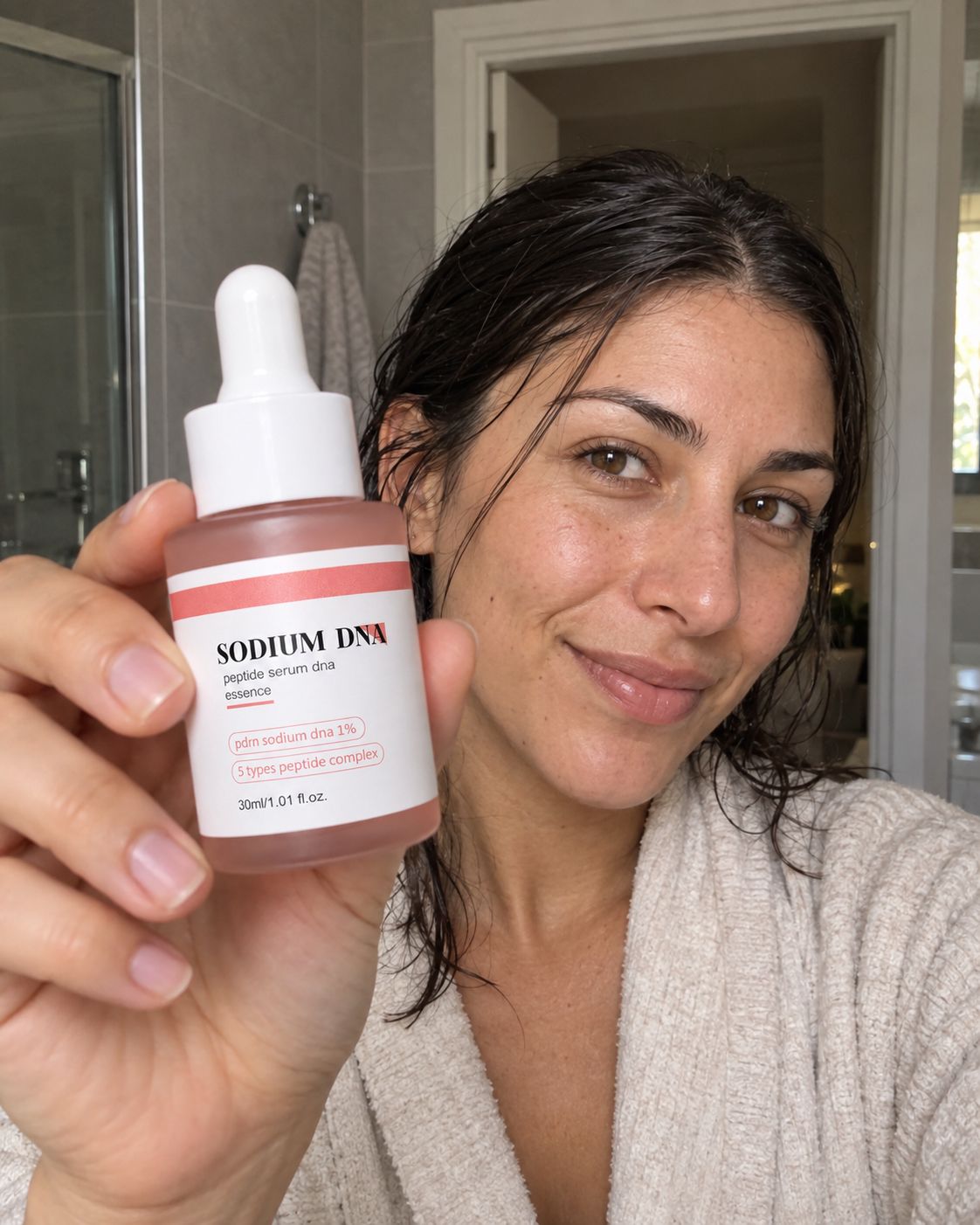 Woman showing Salmora serum to the camera